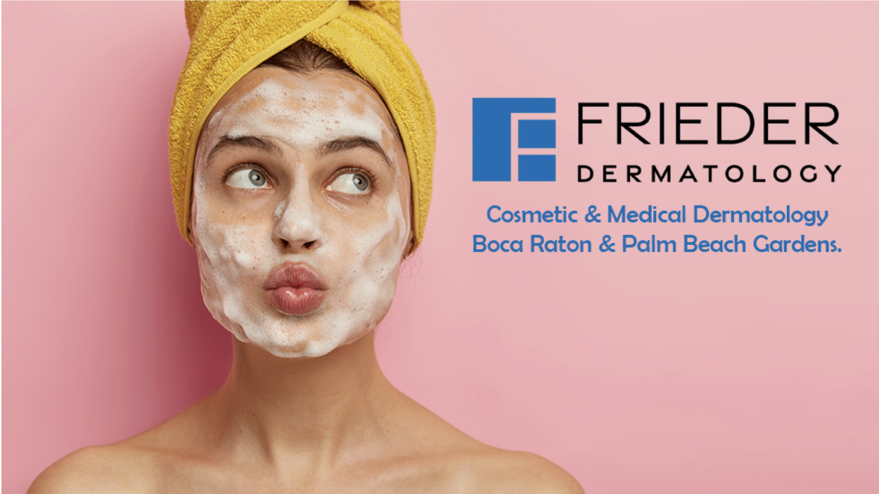 A woman with soap on her face practicing the 4-2-4 rule for skin care and looking up at the logo for Frieder Dermatology